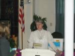 Carolyn at the podium